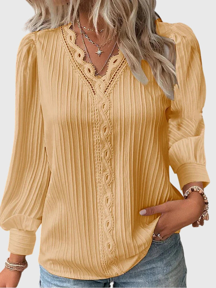 Blusa de mujer, cómoda y elegante, con cuello V de encaje y mangas largas. Ideal para un look sofisticado de primavera.
