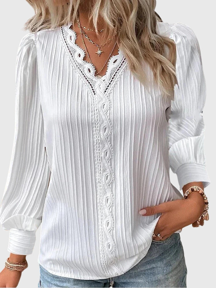 Blusa elegante de manga larga para mujer, con cuello V y delicados detalles de encaje. Ideal para un estilo chic.