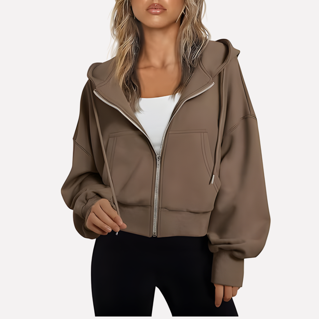 Sudadera de invierno esencial para mujer, con capucha, cremallera y bolsillos funcionales. Cálida y trendy.