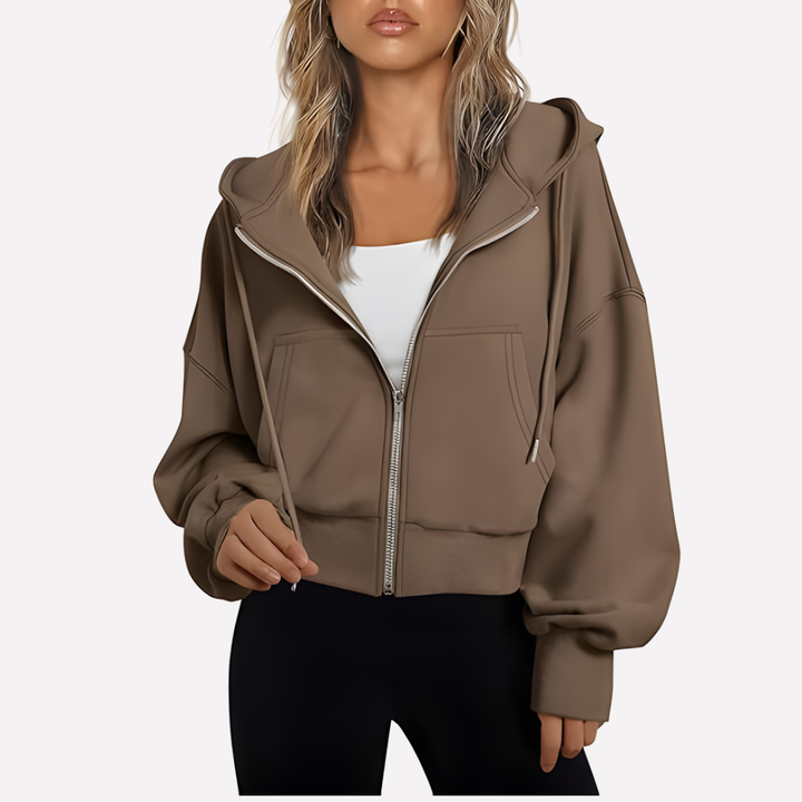 Sudadera de invierno esencial para mujer, con capucha, cremallera y bolsillos funcionales. Cálida y trendy.
