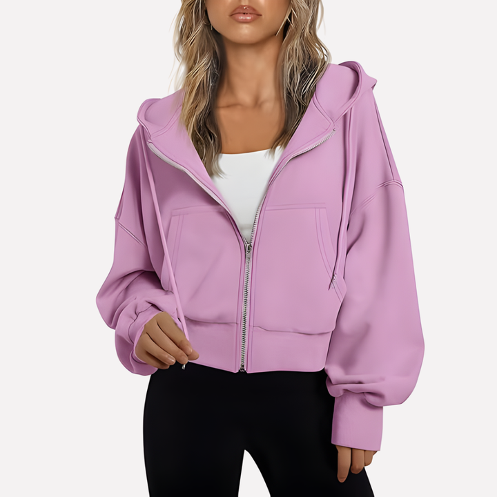 Sudadera moderna de mujer con capucha, cremallera y bolsillos. Look casual chic. Perfecta para el día a día.