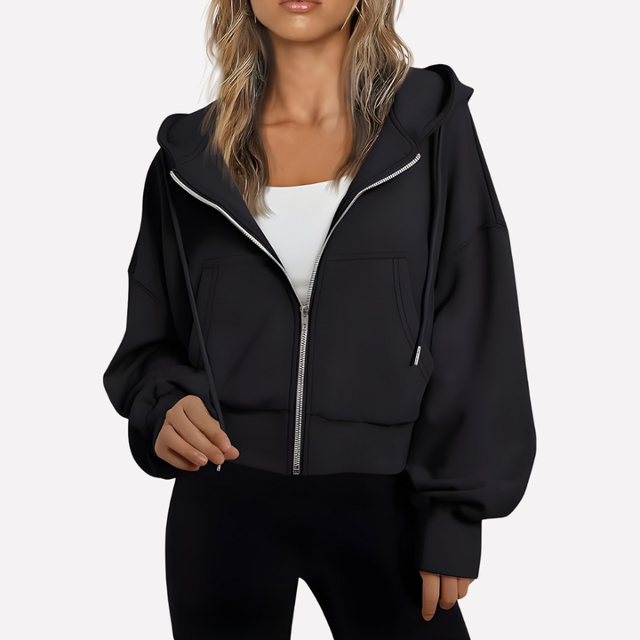 Sudadera cómoda de mujer con capucha, cremallera frontal y bolsillos. Ideal para uso diario y casual.
