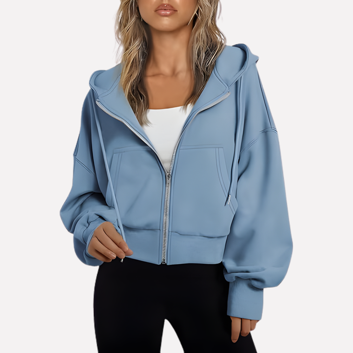 Sudadera holgada de moda para mujer, con capucha, cremallera y bolsillos. Estilo casual y versátil.