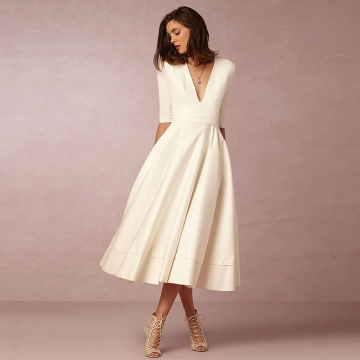 Vestido midi elegante para mujer, con escote V y mangas al codo. Perfecto para eventos y fiestas.
