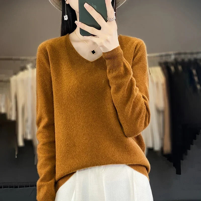 Moda invierno mujer: suéter elegante con cuello V y manga larga.