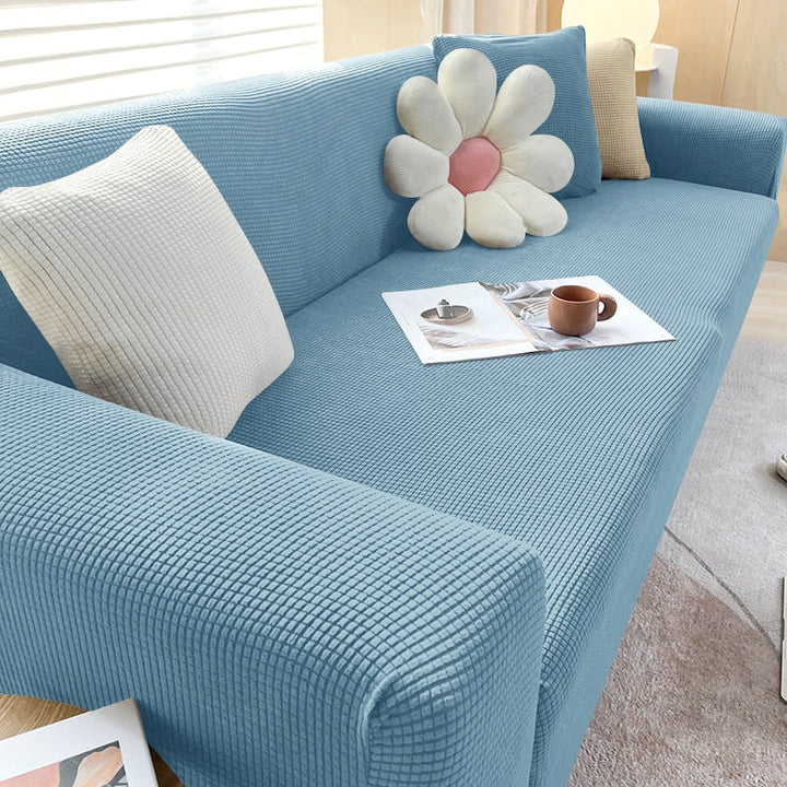 Protector de sofá impermeable y elástico. Decora y protege tus muebles del hogar fácilmente.