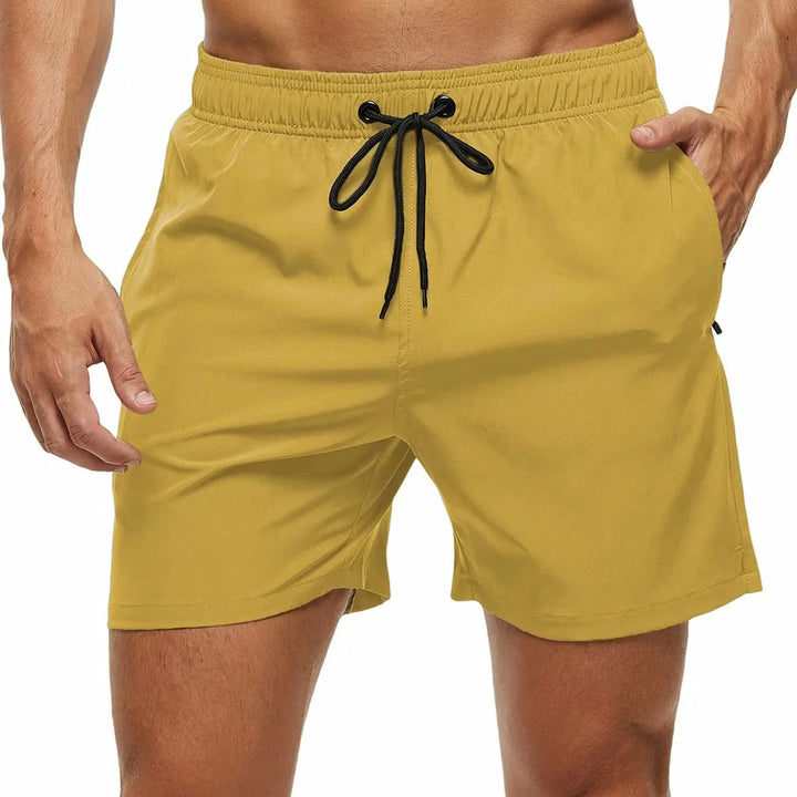 Short de playa liso para hombre, ultraligero y con bolsillo de cremallera. Confort y estilo para el verano.