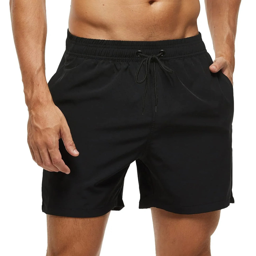 Bañador corto liso Antonio para hombre con bolsillo de cremallera, ideal para playa y natación en verano.