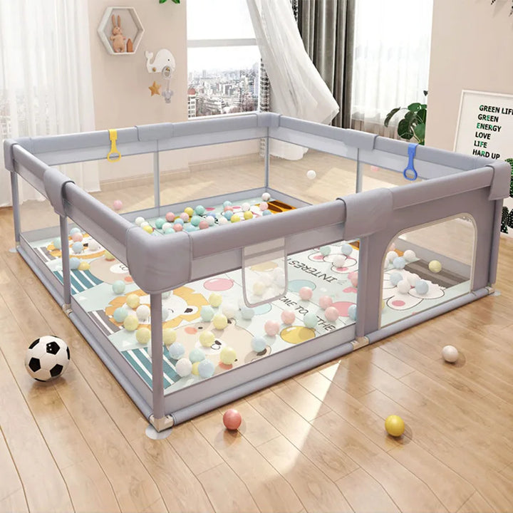 Corral de juego infantil con protección de espuma suave, ideal para la seguridad del bebé en casa.