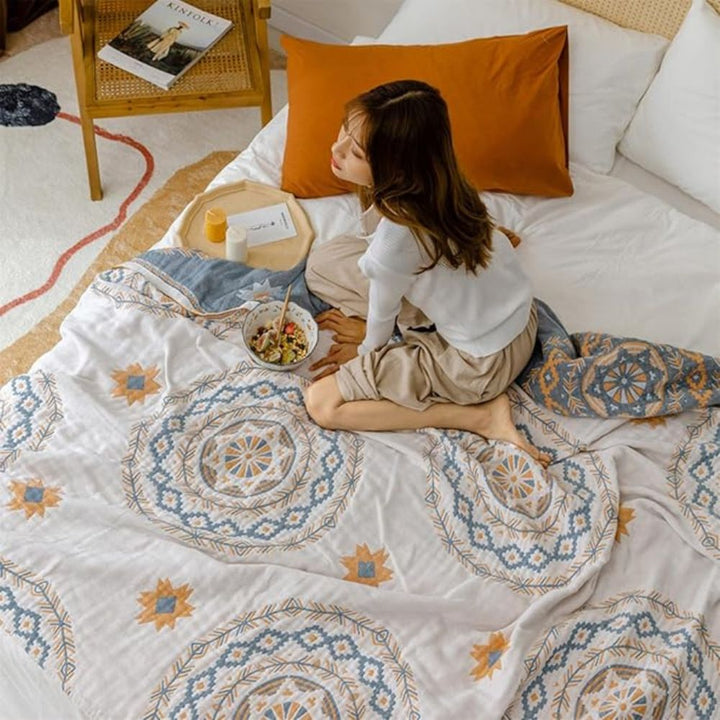 Manta mandala de algodón, ideal para decorar el hogar. Textil bohemio y ligero que aporta un toque sereno a sofá o cama.