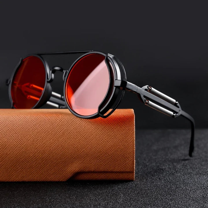 Accesorios de moda: gafas de sol redondas con lentes espejadas y montura unisex de diseño mecánico.