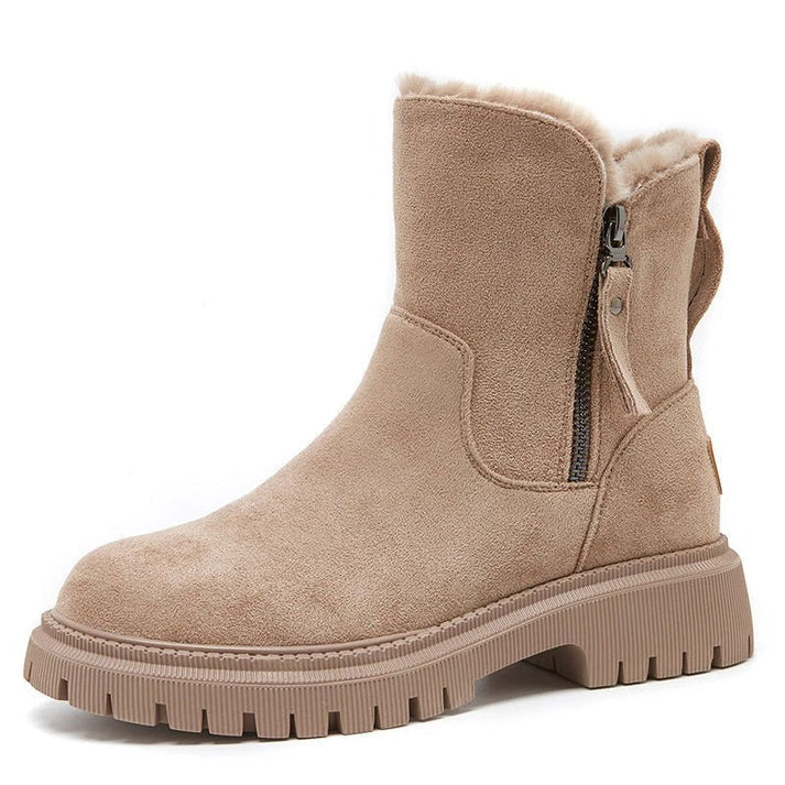 Calzado de invierno para mujer: botines con cremallera lateral y forro suave para máxima calidez.