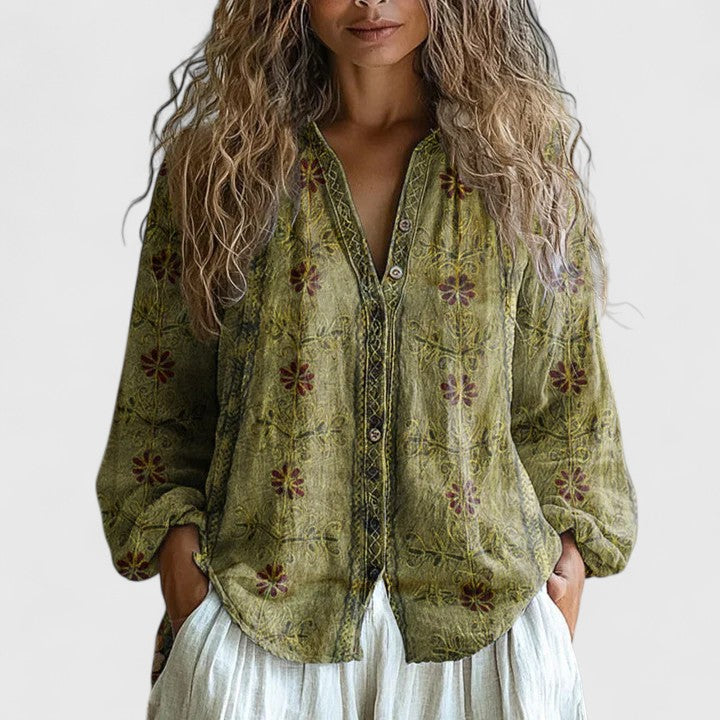Blusa elegante floral para mujer, con cuello V y manga larga. Perfecta para un look primaveral y moderno.