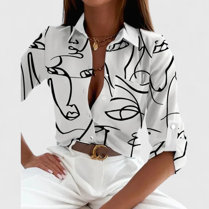 Blusa femenina de manga larga con diseño geométrico vibrante, perfecta para un outfit diario elegante-casual.