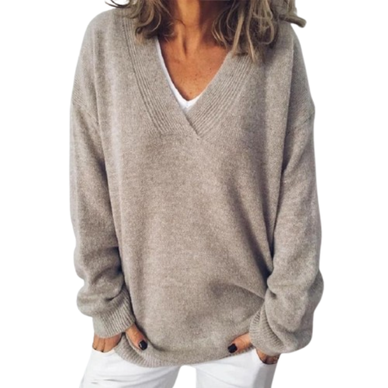 Suéter de punto oversized de mujer, cuello en V y manga larga. Prenda de moda para un look casual de otoño.