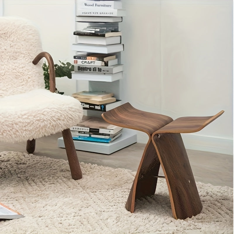 Taburete Mariposa de madera maciza con toque retro. Asiento elegante y diseño atemporal perfecto para tu hogar.