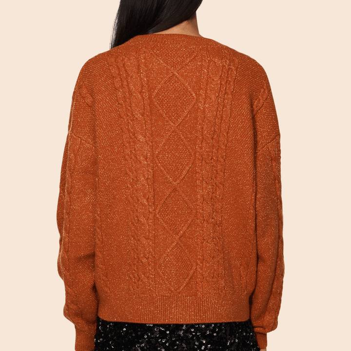 Cárdigan elegante de mujer Showgirl en naranja y beige con estrellas. Abrigo de punto suave, vibrante y cómodo.
