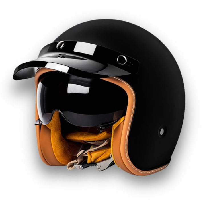 Vista lateral de casco de moto unisex elegante, mostrando doble visera y diseño seguro para viaje.