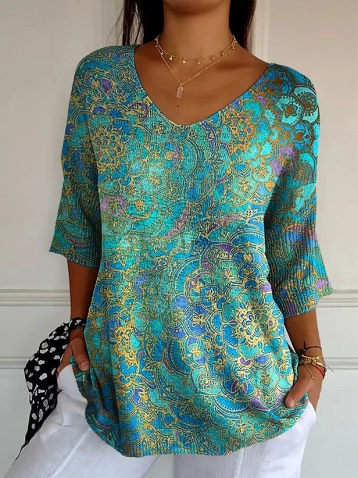Blusa estampada fluida para mujer, escote V. Estilo bohemio elegante, ideal para primavera y verano.