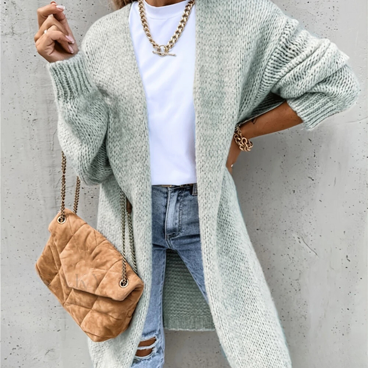 Cárdigan de punto para mujer, frente abierto. Mangas caídas que ofrecen un look relajado. Ropa femenina de moda.