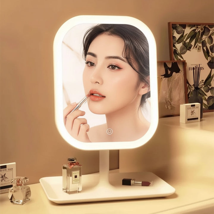Espejo de tocador LED con luz regulable y control táctil, perfecto para maquillaje y cuidado de la piel.