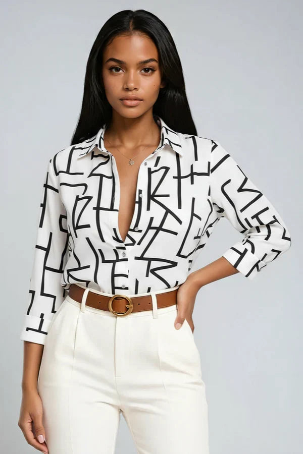 Blusa fluida ELVINA para mujer, estampado vibrante, perfecta para un look elegante y versátil.