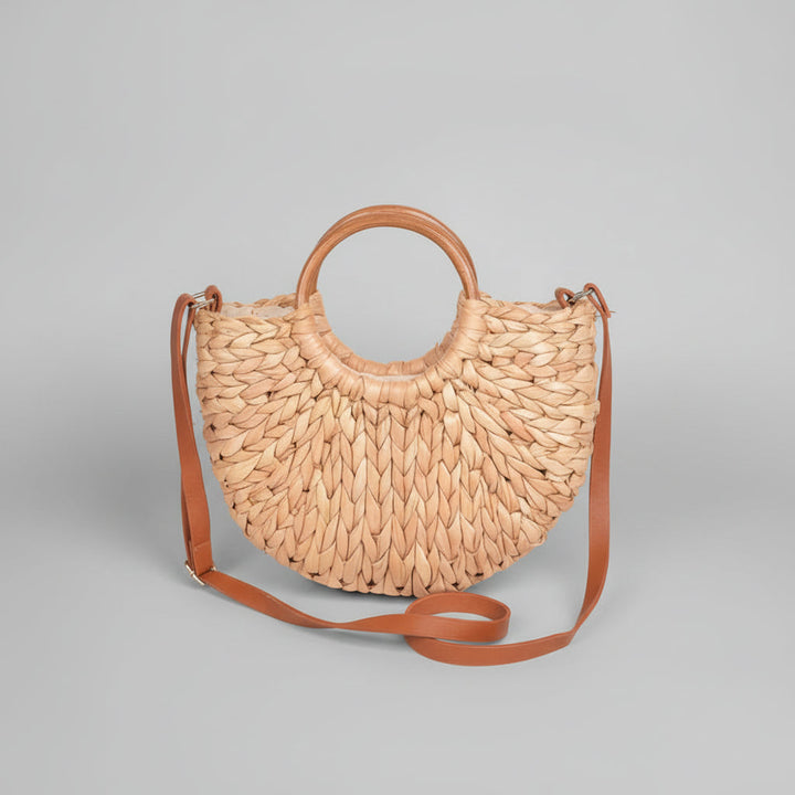 Clutch de paja elegante para mujer con asa de nudo torcido. Accesorio casual de verano para playa.