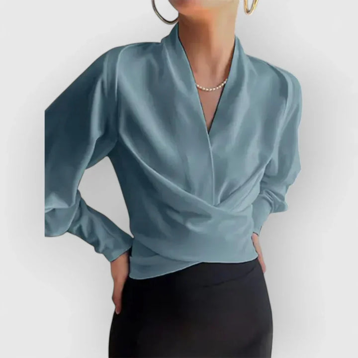Moderna blusa de mujer con mangas abullonadas, que ofrece comodidad y elegancia en cualquier ocasión.