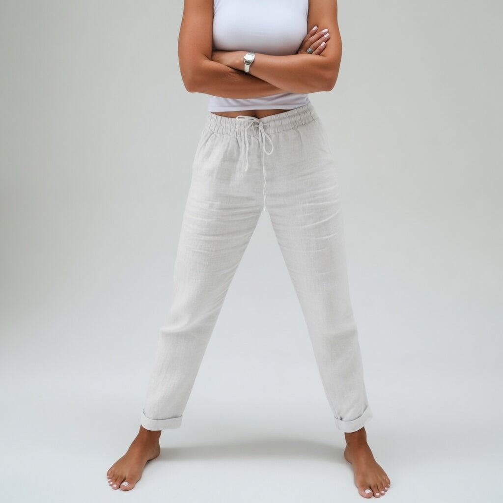 Pantalón de mujer fluido de algodón con cintura elástica y bolsillos, perfecto para un look versátil y fresco.