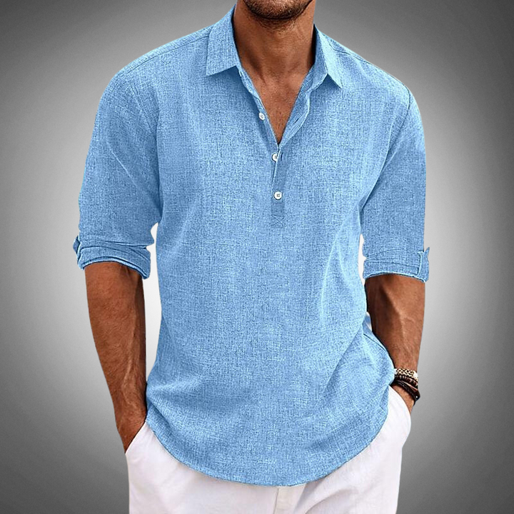 Camisa de lino azul para hombre, manga larga, fresca y elegante. Ideal para verano y estilo casual-elegante.