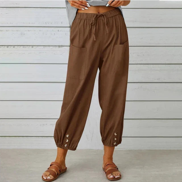 Pantalón de mujer fluido y fresco, cintura elástica, estilo veraniego casual.