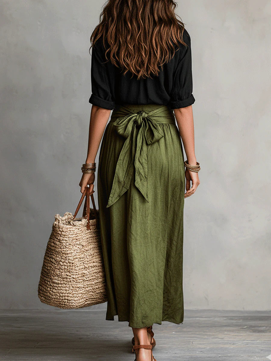 Falda midi verde olivo con camiseta negra ajustada. Conjunto de ropa para mujer, estilo moderno y cómodo.