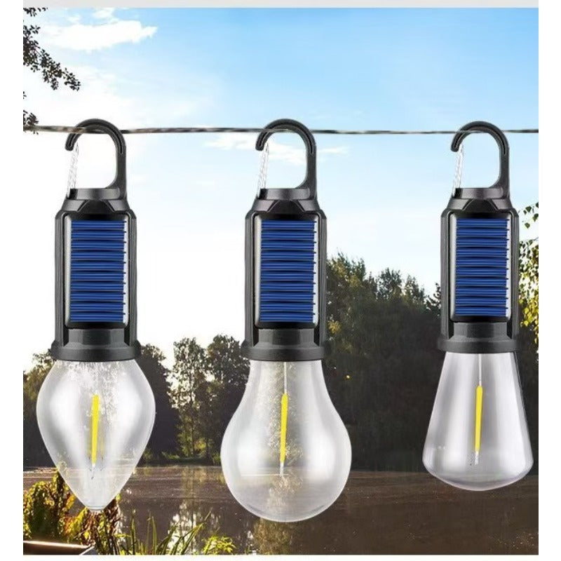 Linterna LED de camping solar y USB recargable, ideal para iluminación portátil en aventuras.