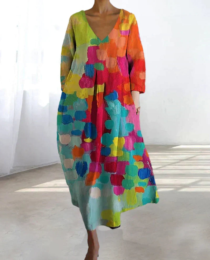 Vestido largo elegante con estampado artístico y escote V. Ideal para invitada de boda, graduación o fiesta de verano. Estilo fluido.