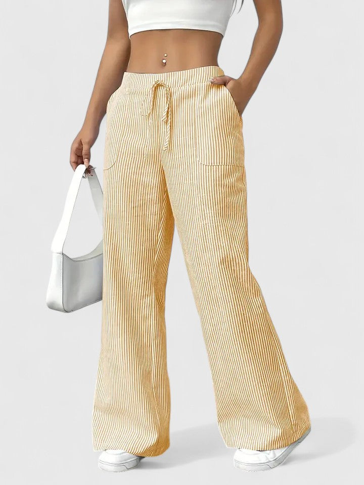 Pantalón ancho de mujer rosa. Cómodo, cintura ajustable y estilo veraniego casual.