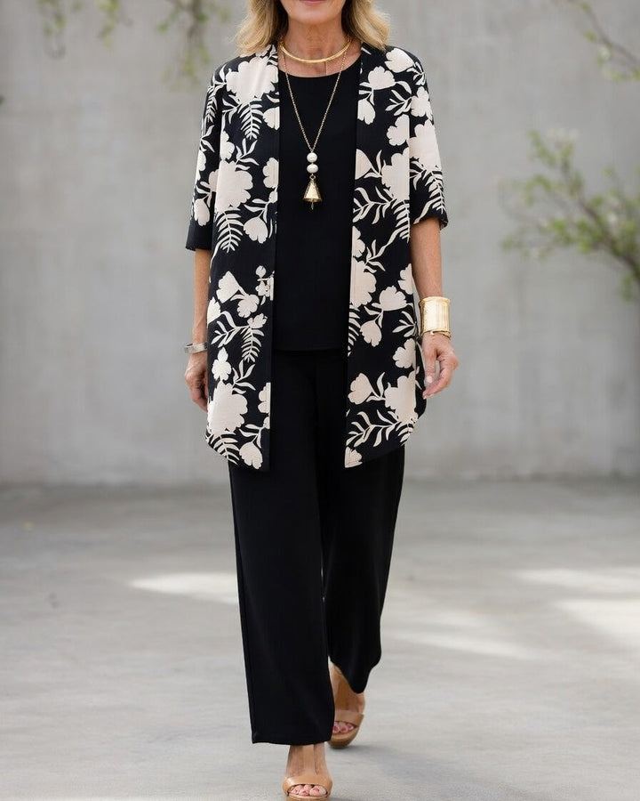 Chaqueta floral detallada en conjunto elegante de mujer 3 piezas. Incluye pantalón fluido y top a juego.