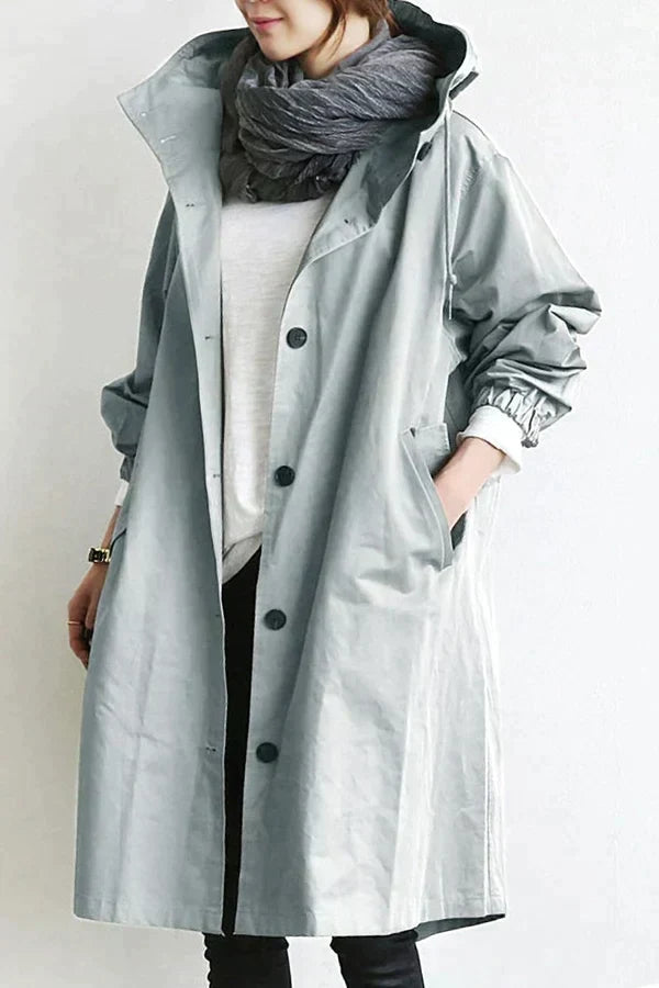 Estiloso trench coat impermeable oversize para mujer, un abrigo versátil de media longitud para cualquier look.