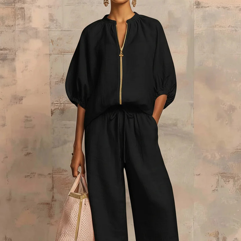 Conjunto de moda femenino con blusa moderna de cremallera y pantalón fluido holgado. Ideal para el día a día.
