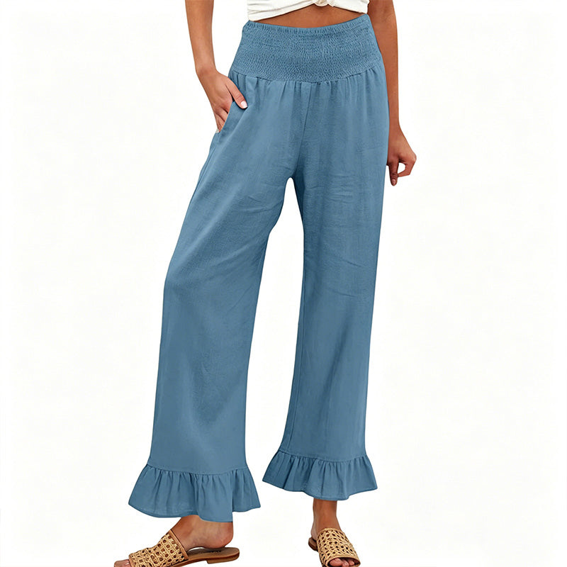 Estiloso pantalón ancho de mujer, tejido algodón y lino, tiro alto smock, look bohemio casual de verano.