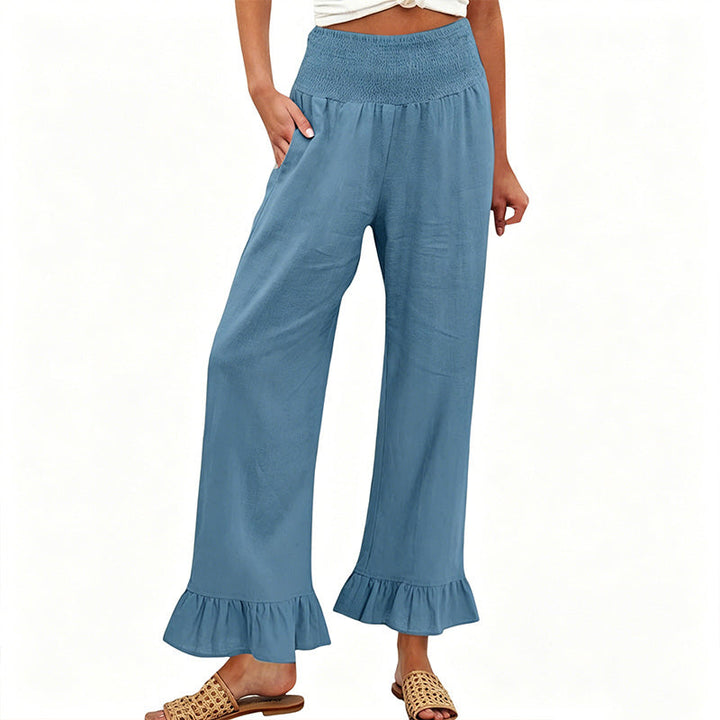Estiloso pantalón ancho de mujer, tejido algodón y lino, tiro alto smock, look bohemio casual de verano.
