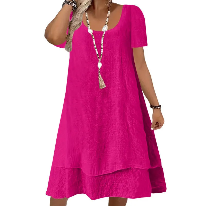 Vestido de mujer amplio y holgado, manga corta, cuello redondo. Look casual de verano, confeccionado en algodón.