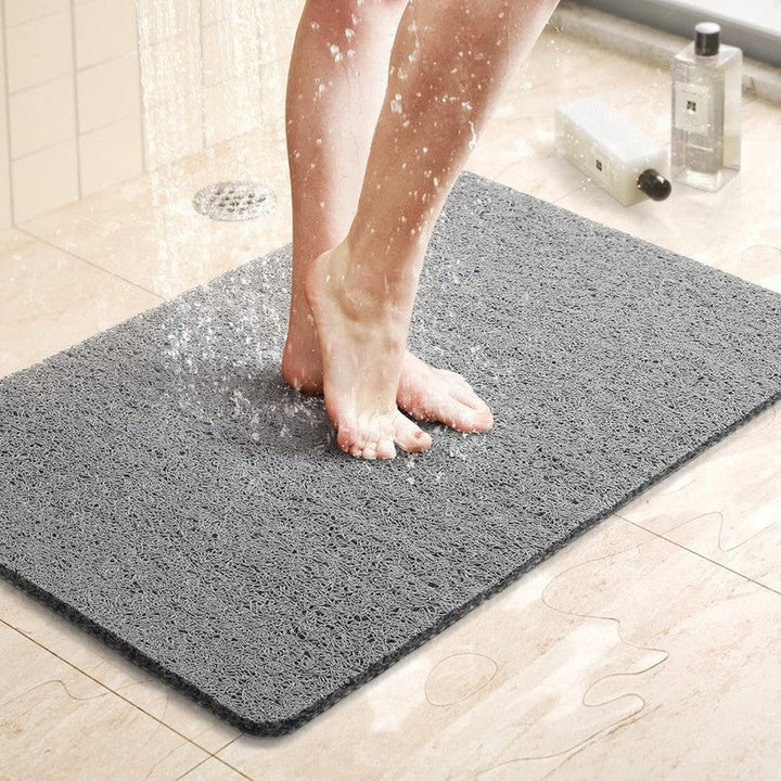 Alfombra antideslizante rectangular para ducha y baño, gris. Garantiza seguridad y comodidad en el hogar.
