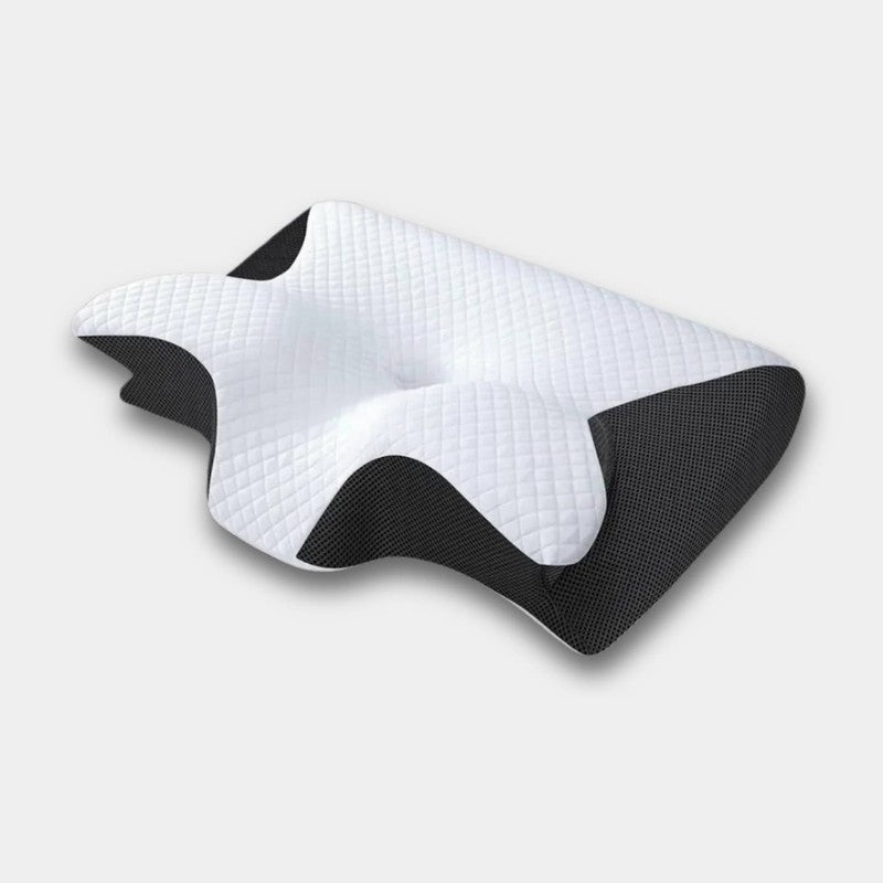 Almohada ergonómica para cuello en cama, ofreciendo soporte viscoelástico y memoria de forma para descanso profundo.