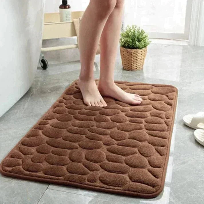 Alfombrilla de seguridad antideslizante para ducha, mejora higiene y previene resbalones en el hogar.