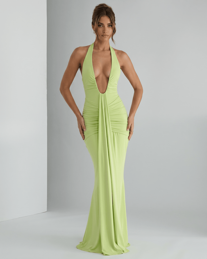 Vestido maxi elegante para eventos formales, diseño halter y espalda abierta.
