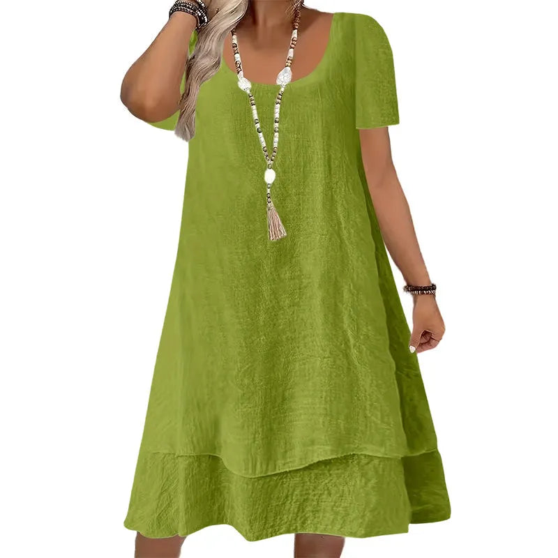 Vestido de mujer casual con cuello redondo y manga corta. Diseño amplio y fresco, perfecto para el clima cálido.