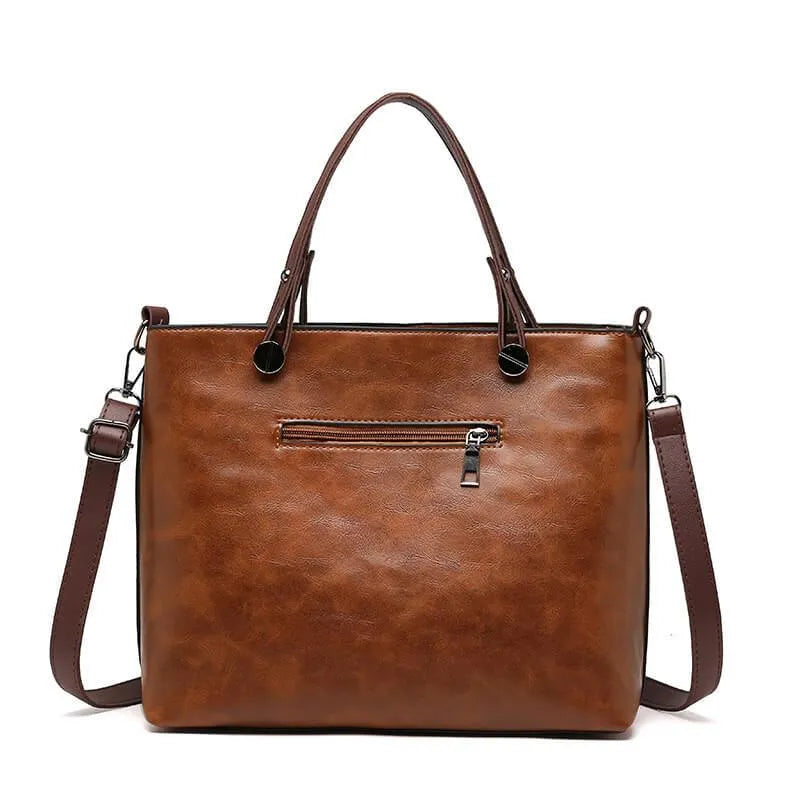 Bolso clásico gris de cuero sintético, diseño vintage para mujer. Estilo atemporal.