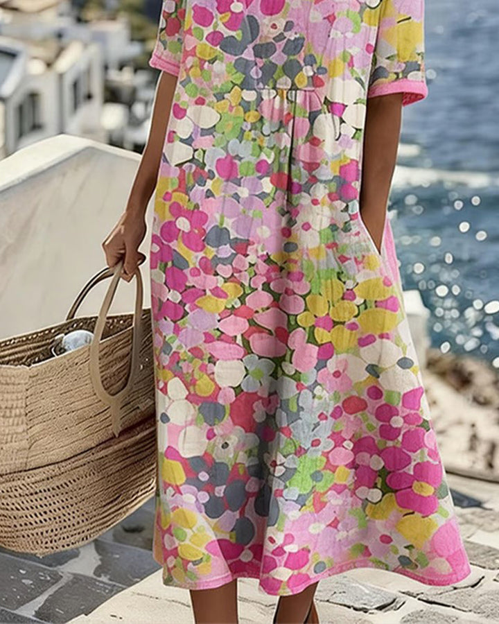 Vestido floral midi con manga corta y bolsillos, diseño casual elegante para mujer.