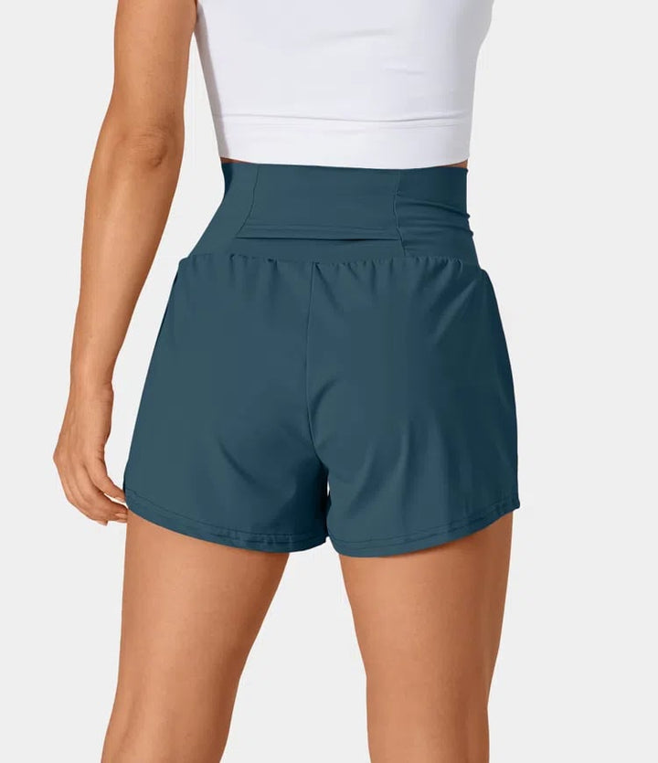 Short de entrenamiento femenino, cintura alta, bolsillos, perfecto para correr y gym.