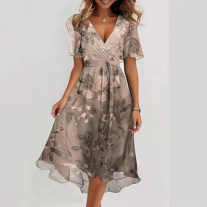Elegante vestido midi estampado, con detalle cruzado. Moda femenina ideal para invitadas de boda y fiestas de día.